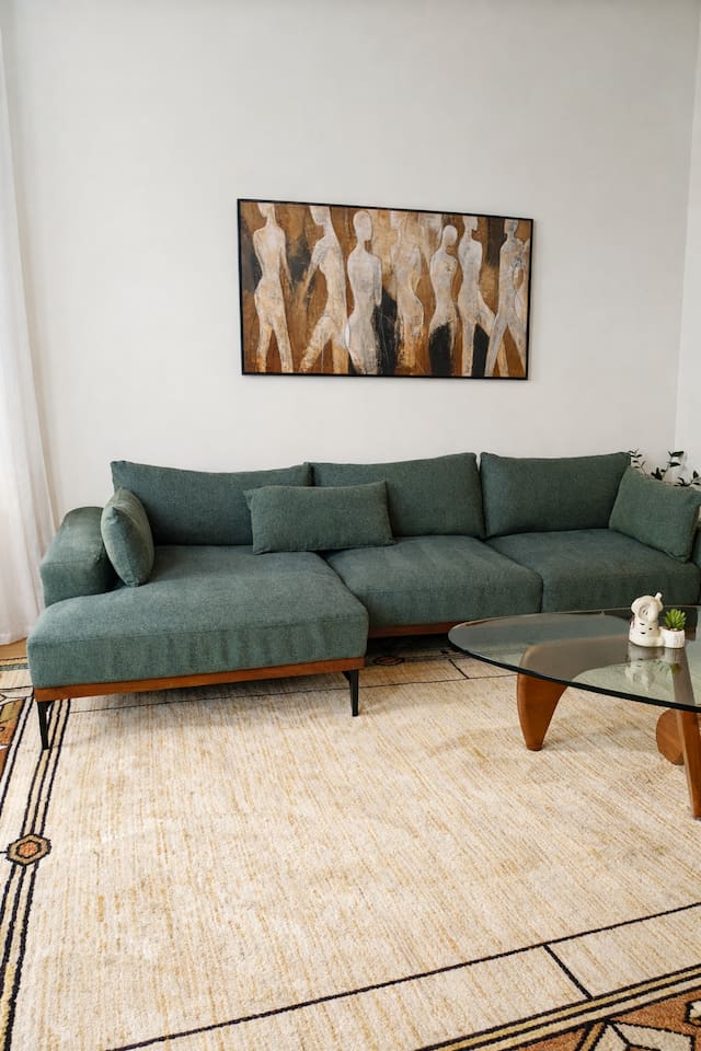 Comfortable living room seating area with warm decor.