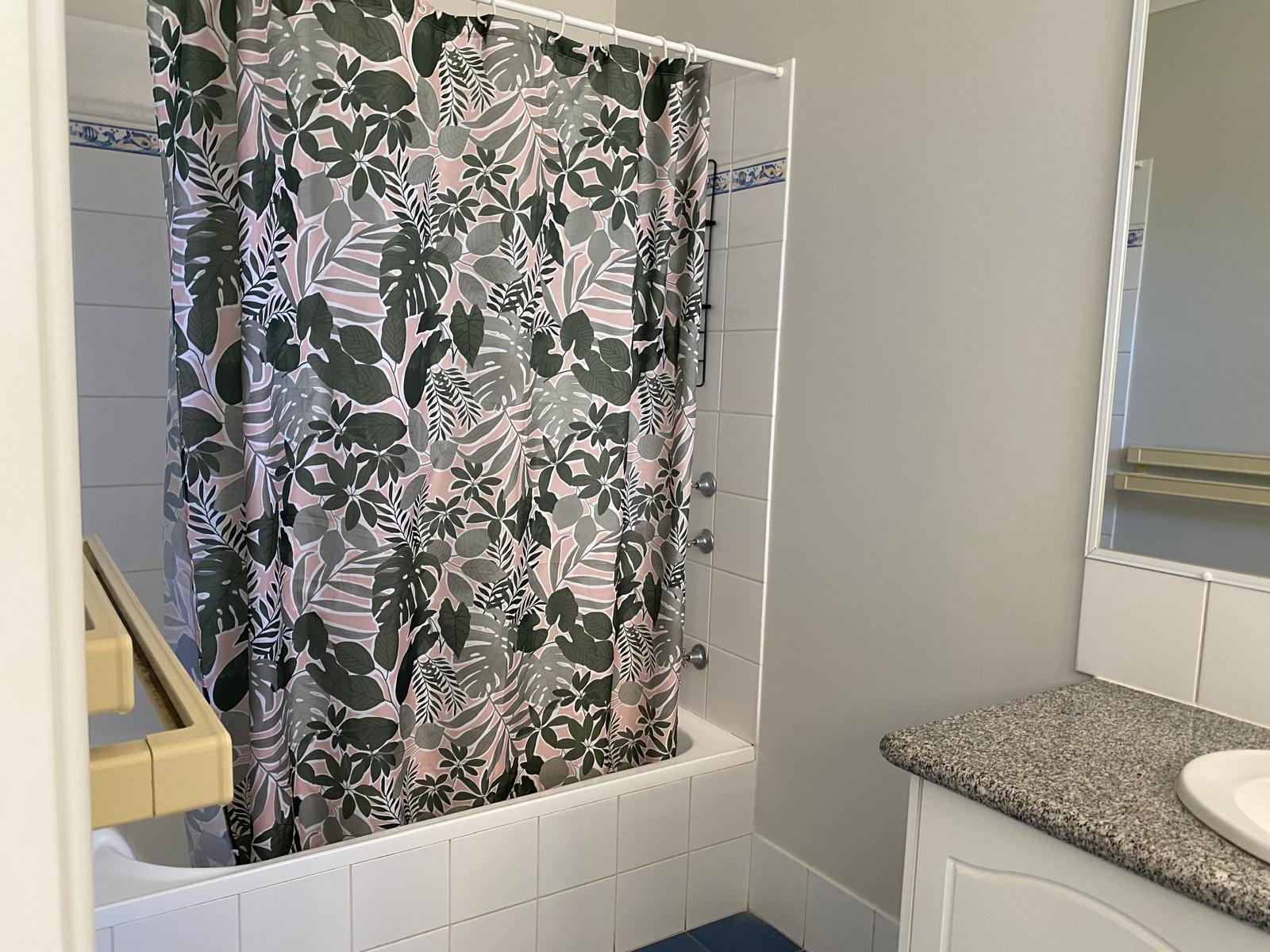 Main Bathroom downstairs with bath