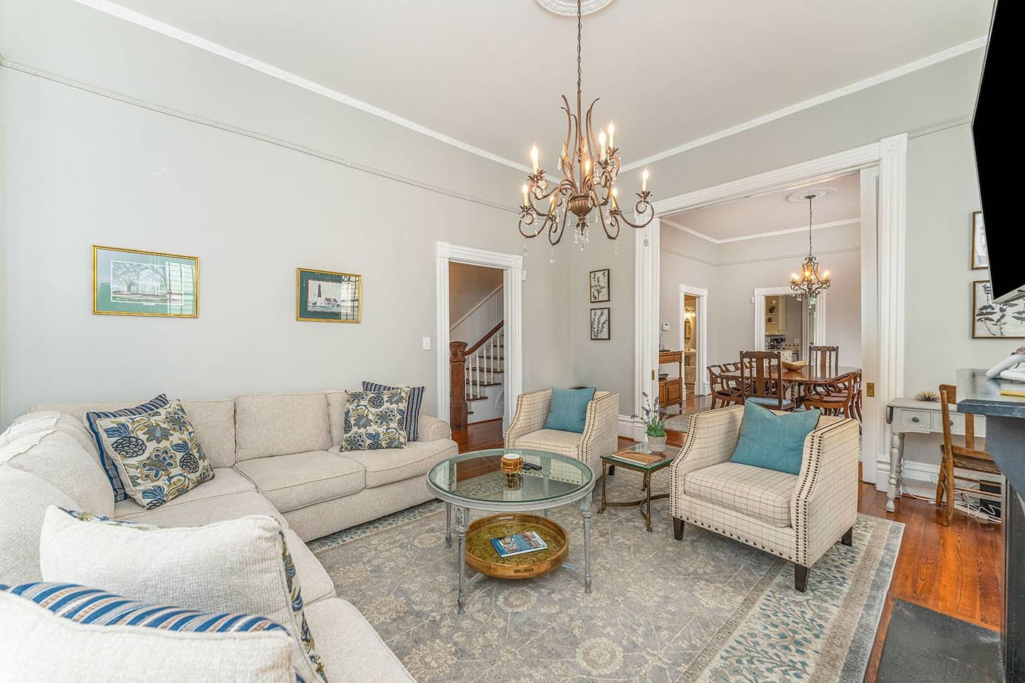 Stain glass windows facing south let in brilliant light throughout the day!  Spacious with double pocket doors leading into the dining room - great for entertaining.  Close the pocket doors, pull out the sofa bed make this living room a 4th bedroom!