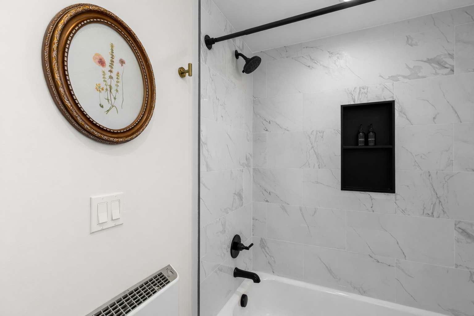 Sleek, spa-inspired shower with modern fixtures, elegant tile, and built-in storage—perfect for refreshing mornings or unwinding after a long day.