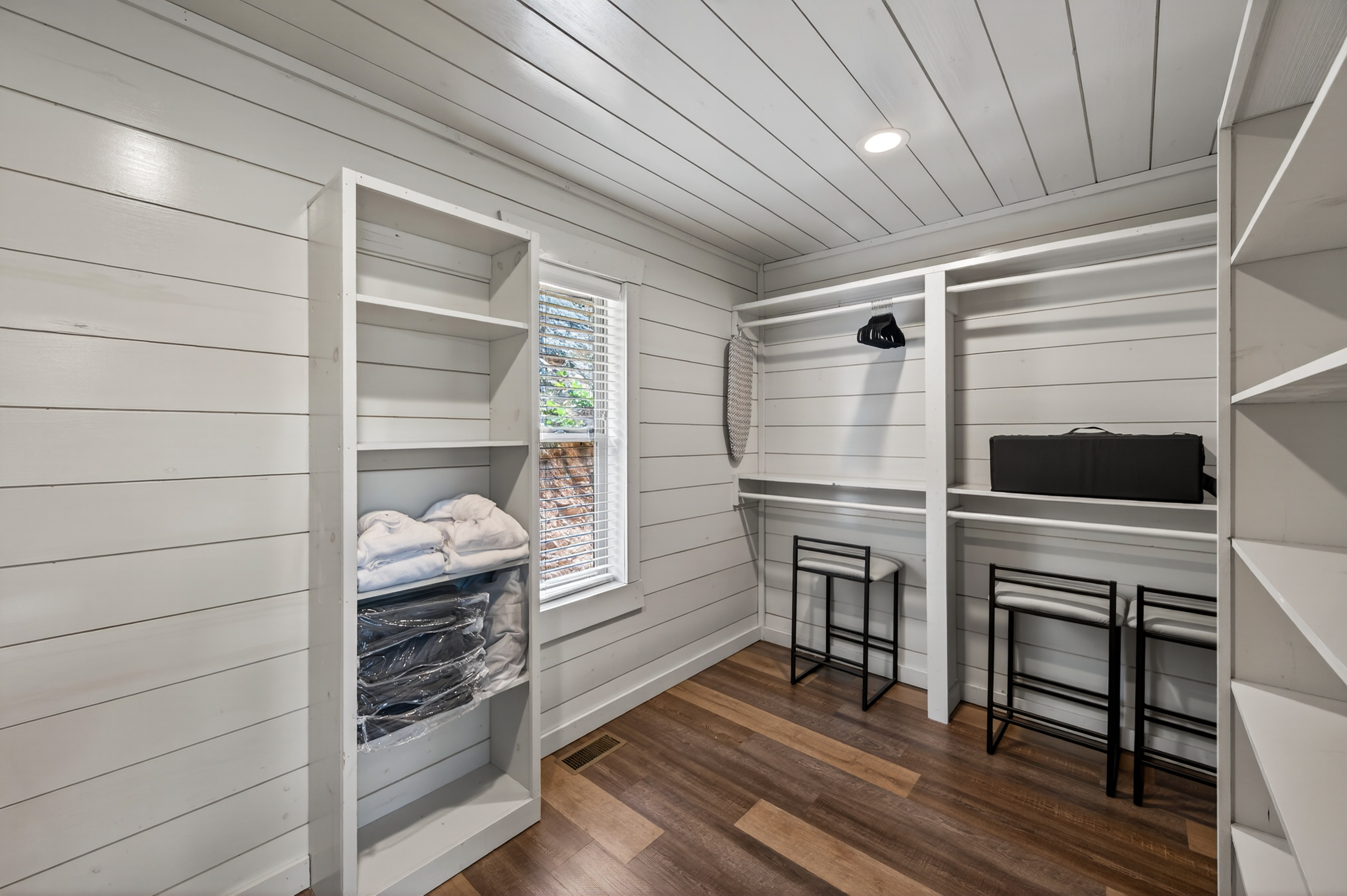 Walk-in closet with washer and dryer.