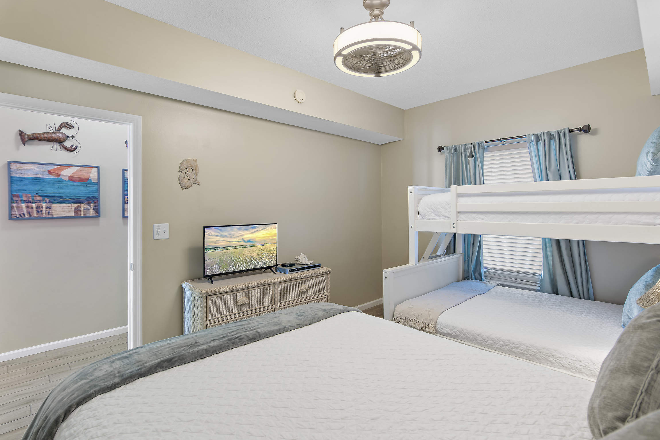 3rd bedroom has QUEEN BED, TWIN OVER FULL BUNK BEDS, Smart TV w/ cable, private bathroom, and closet