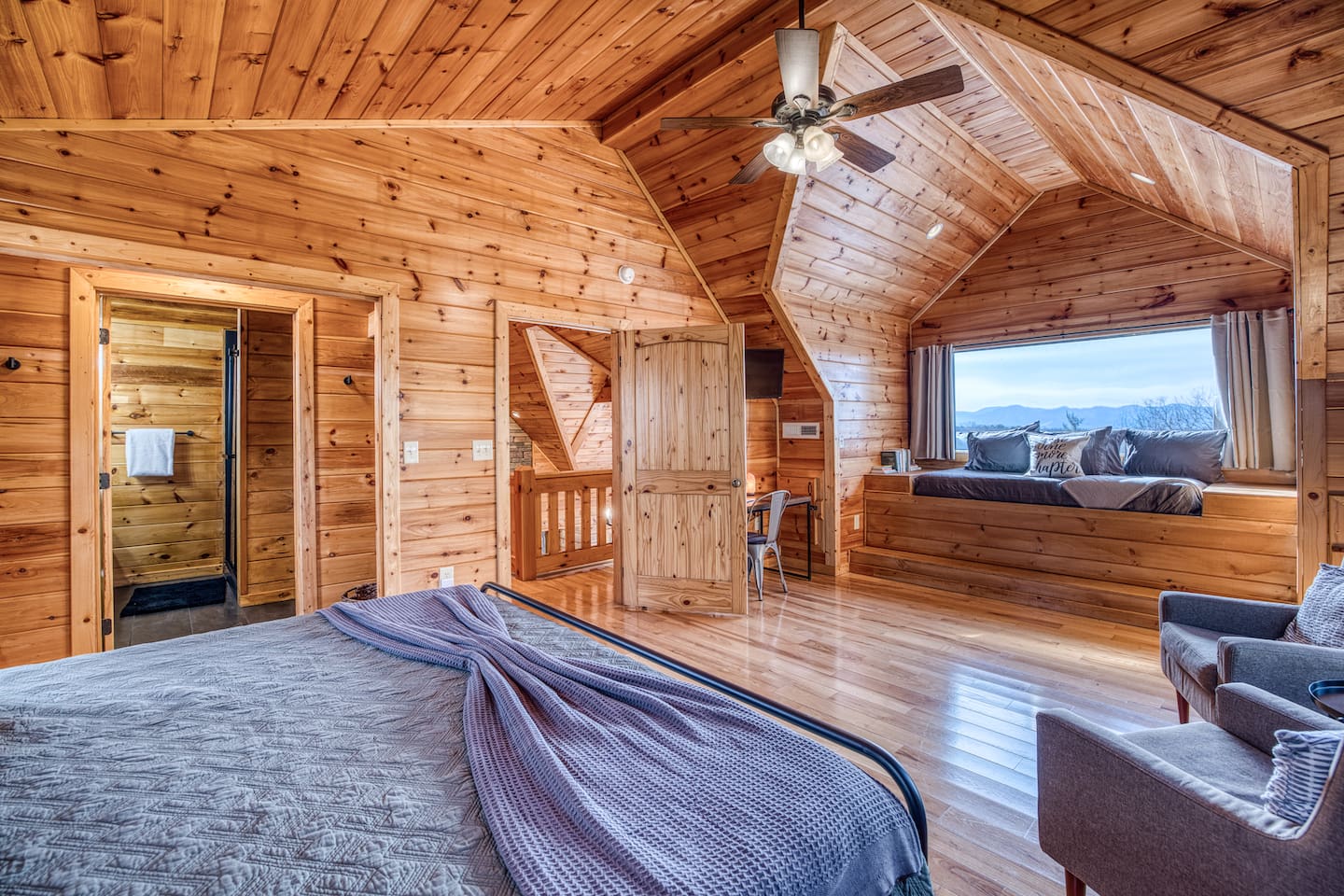 Huge window & amazing mountain views from one of the 2 upstairs bedrooms, both with a sleeping nook with a twin bed (and both also have a king bed and private bathrooms).