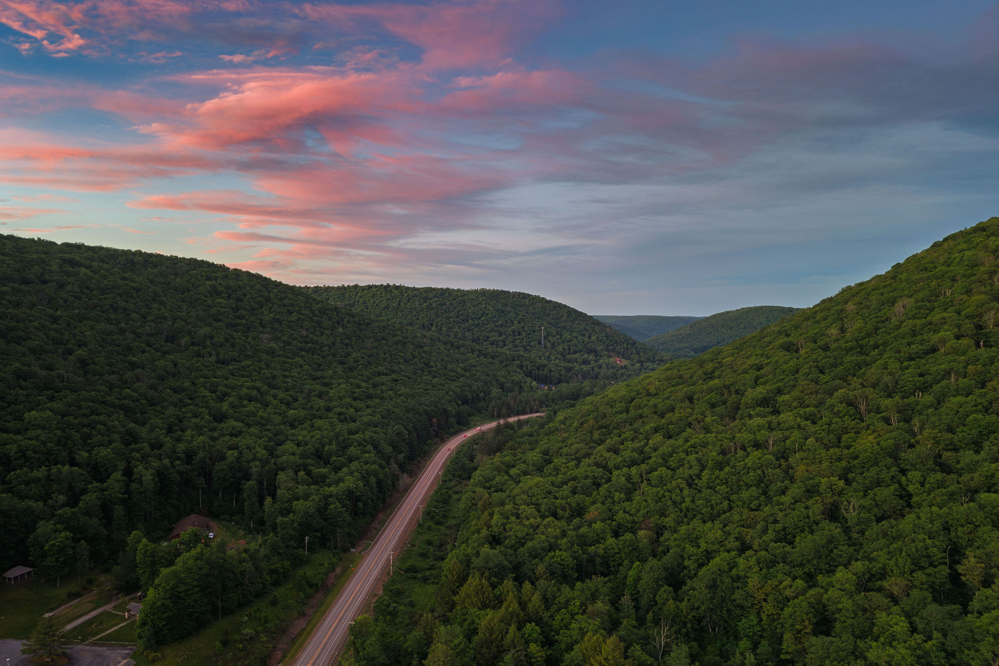 🛣 The Route 6 Scenic Byway winding through Potter County at golden hour.