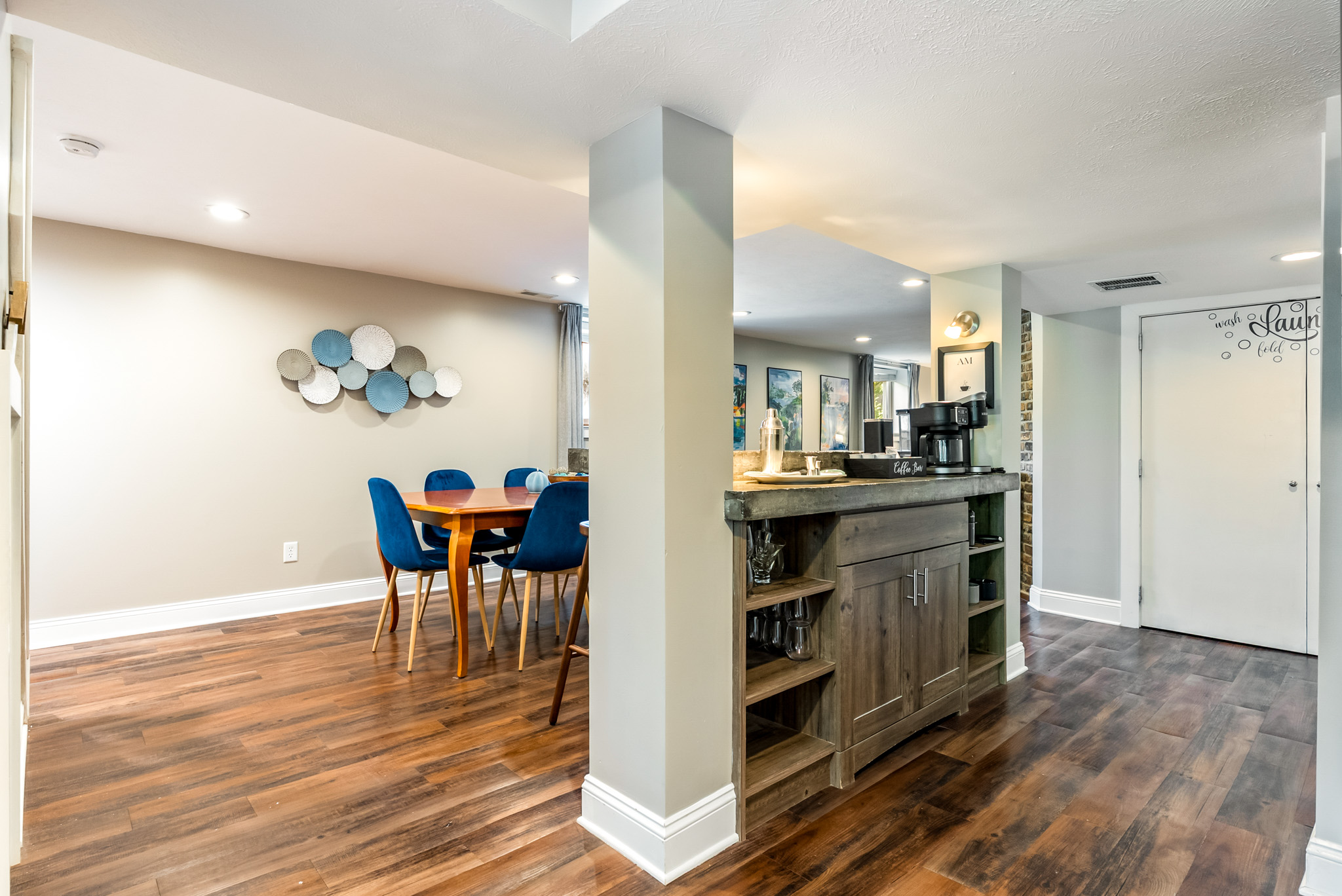 An open, functional layout. The dining space connects seamlessly to the dedicated coffee bar and breakfast counter, making it easy to serve morning meals or catch up on emails.
