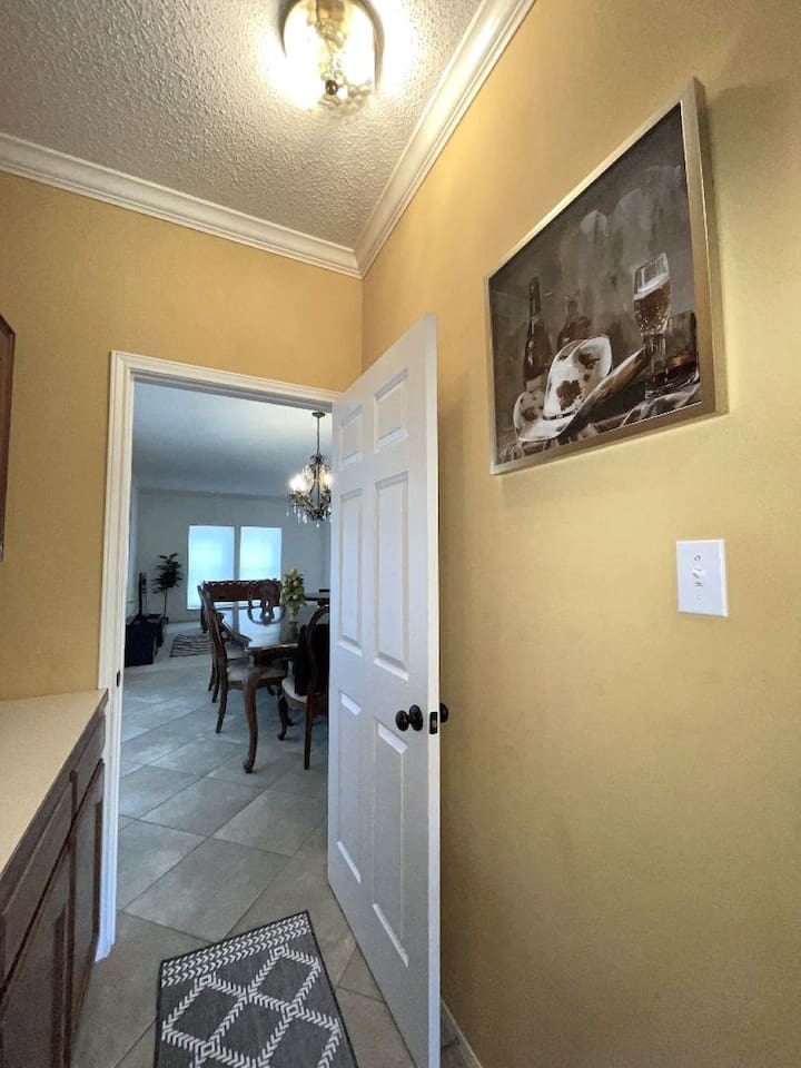 Butler's Pantry joins kitchen to dining and front living room, and provides added counter space and storage.