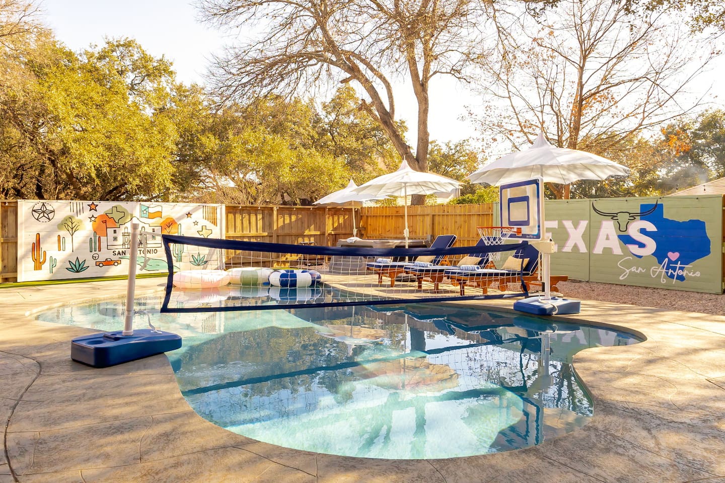 Soak up the Texas sunshine in this stylish, Insta-worthy pool paradise—complete with games, loungers, and a custom mural for the ultimate group getaway vibe