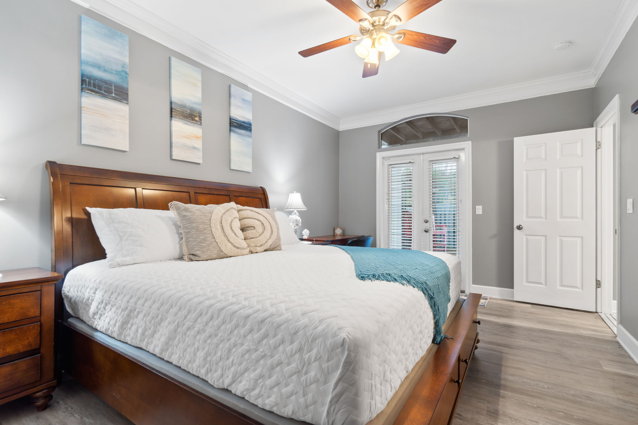 Master bedroom with a king bed on the main level and walkout
