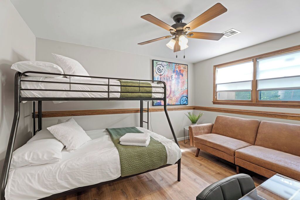 Pile the whole gang in this efficiently furnished bedroom featuring a futon bed!