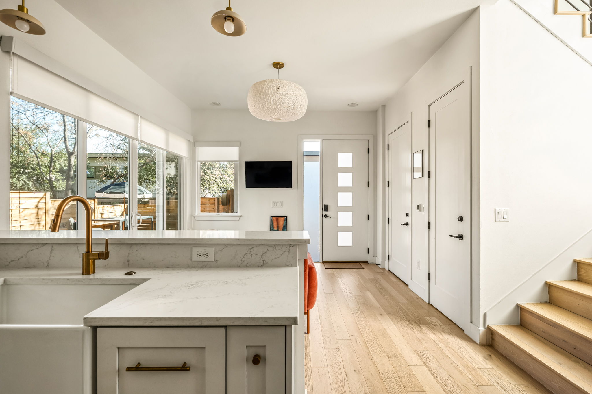 Open-concept kitchen with island seating and natural light
