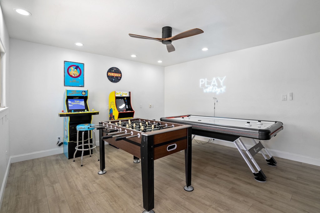 Game room with darts and vintage arcade games