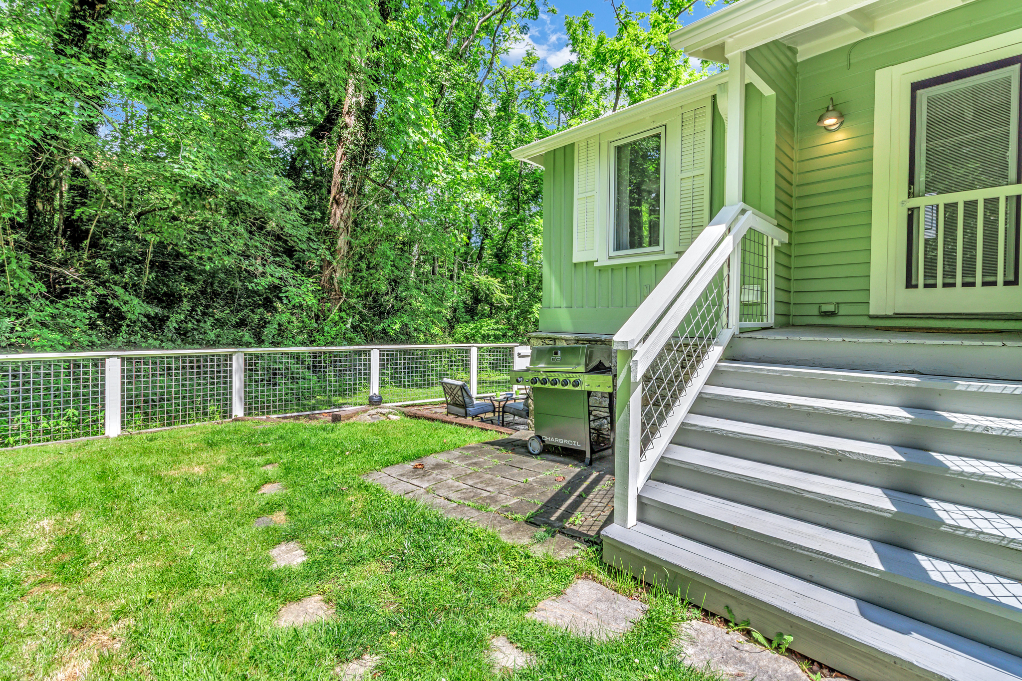 Steps from back door into fenced yard