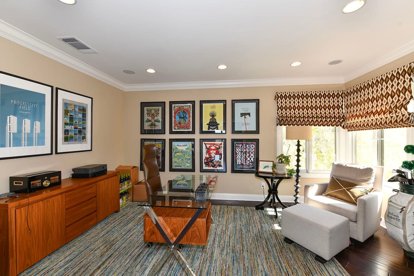 Office with desk, chair, and fireplace.