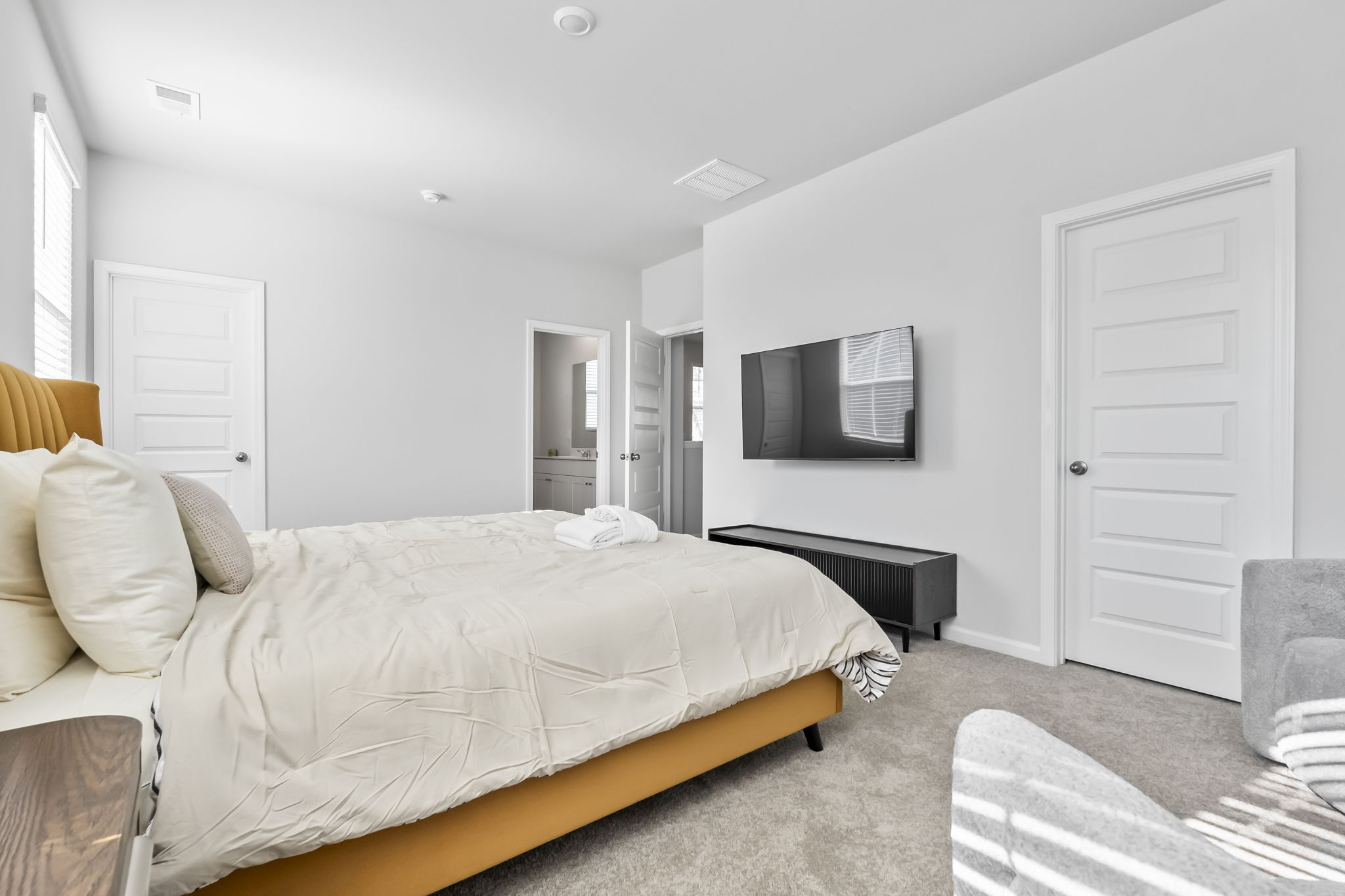 Master Bedroom with Roku Smart TV, walk in closet and ensuite bathroom