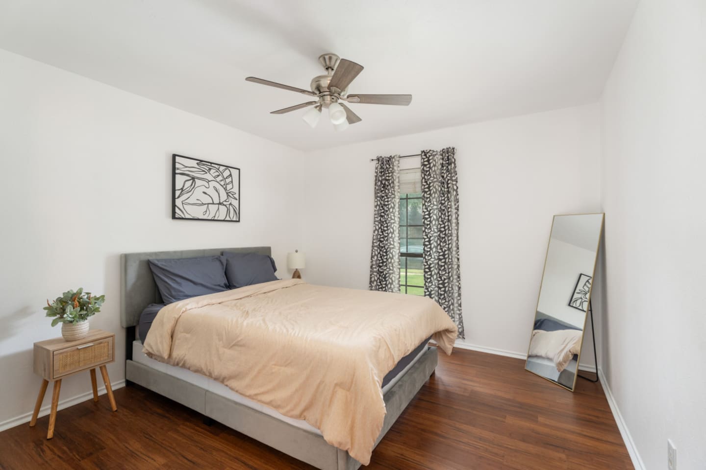 Bedroom with neutral tones and natural light for relaxation.