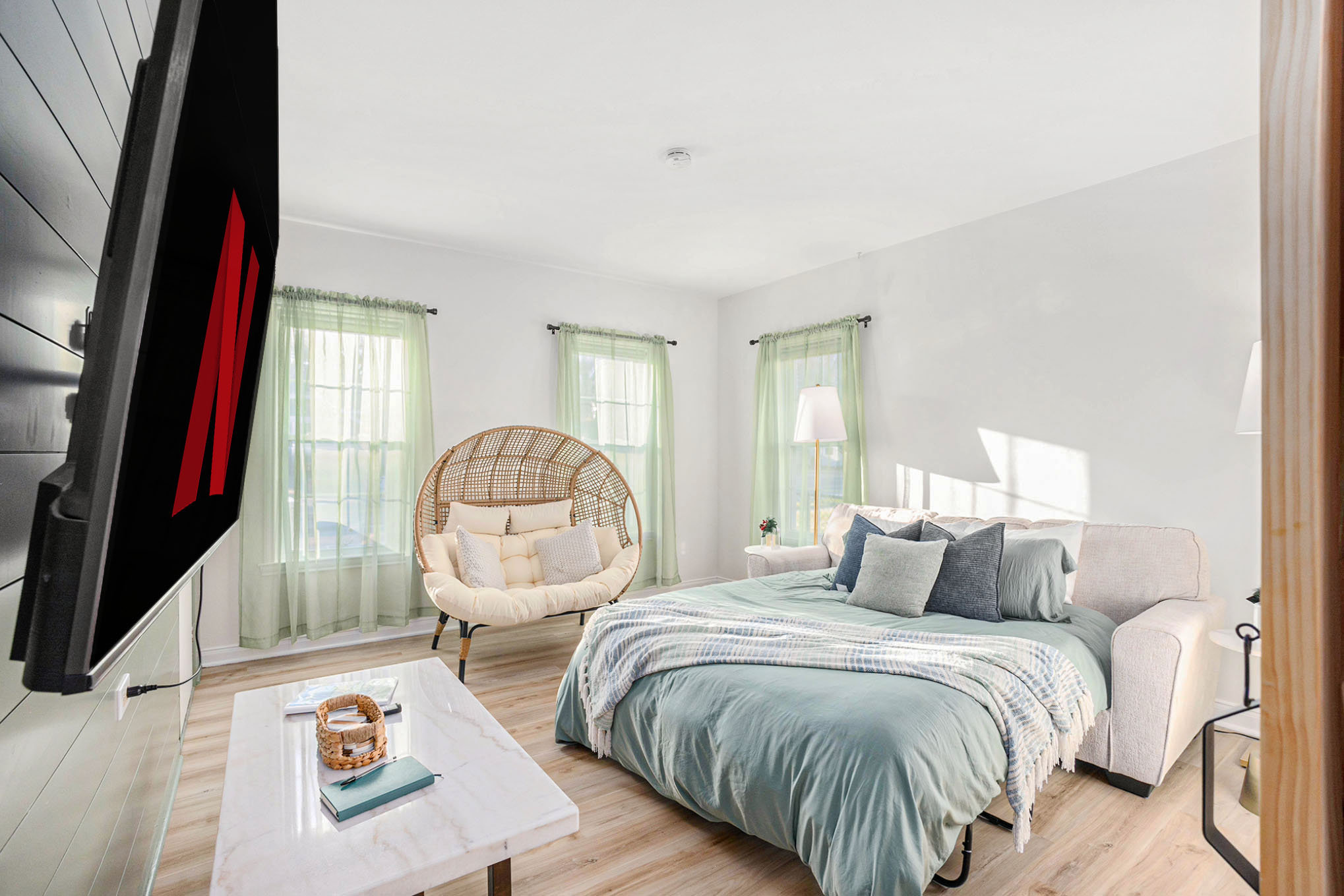 Queen sofabed and barn door create a private second bedroom