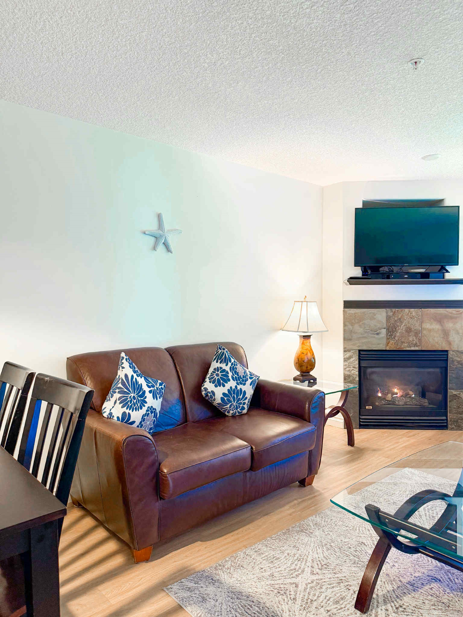 Unit A Couch and natural gas Fireplace.