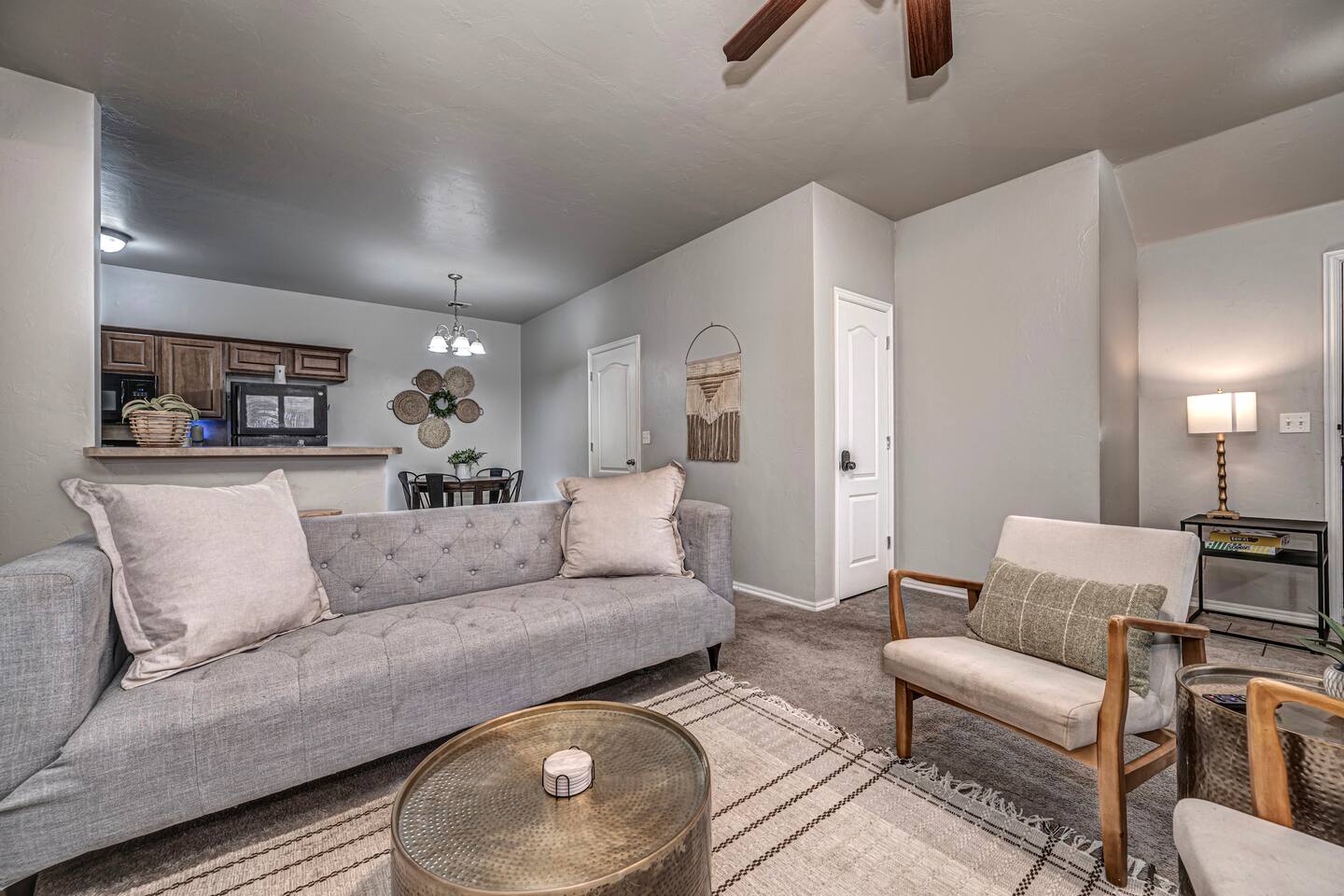 Spacious living area featuring comfortable seating, smart TV, and a warm fireplace.