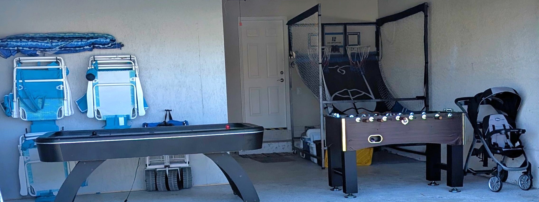 Enjoy foosball, basketball, and air hockey in the garage game room. EV charger available.