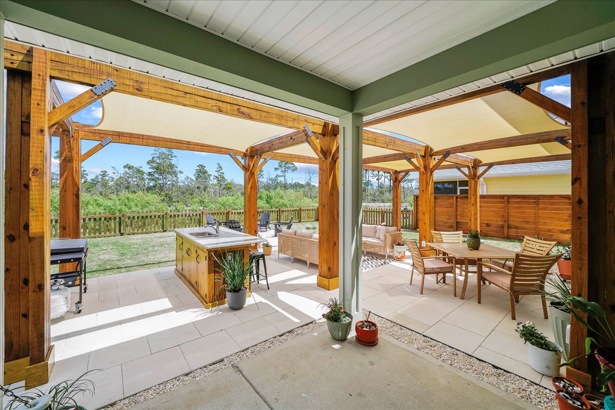 Enjoy outdoor living in this spacious fenced backyard and outdoor seating