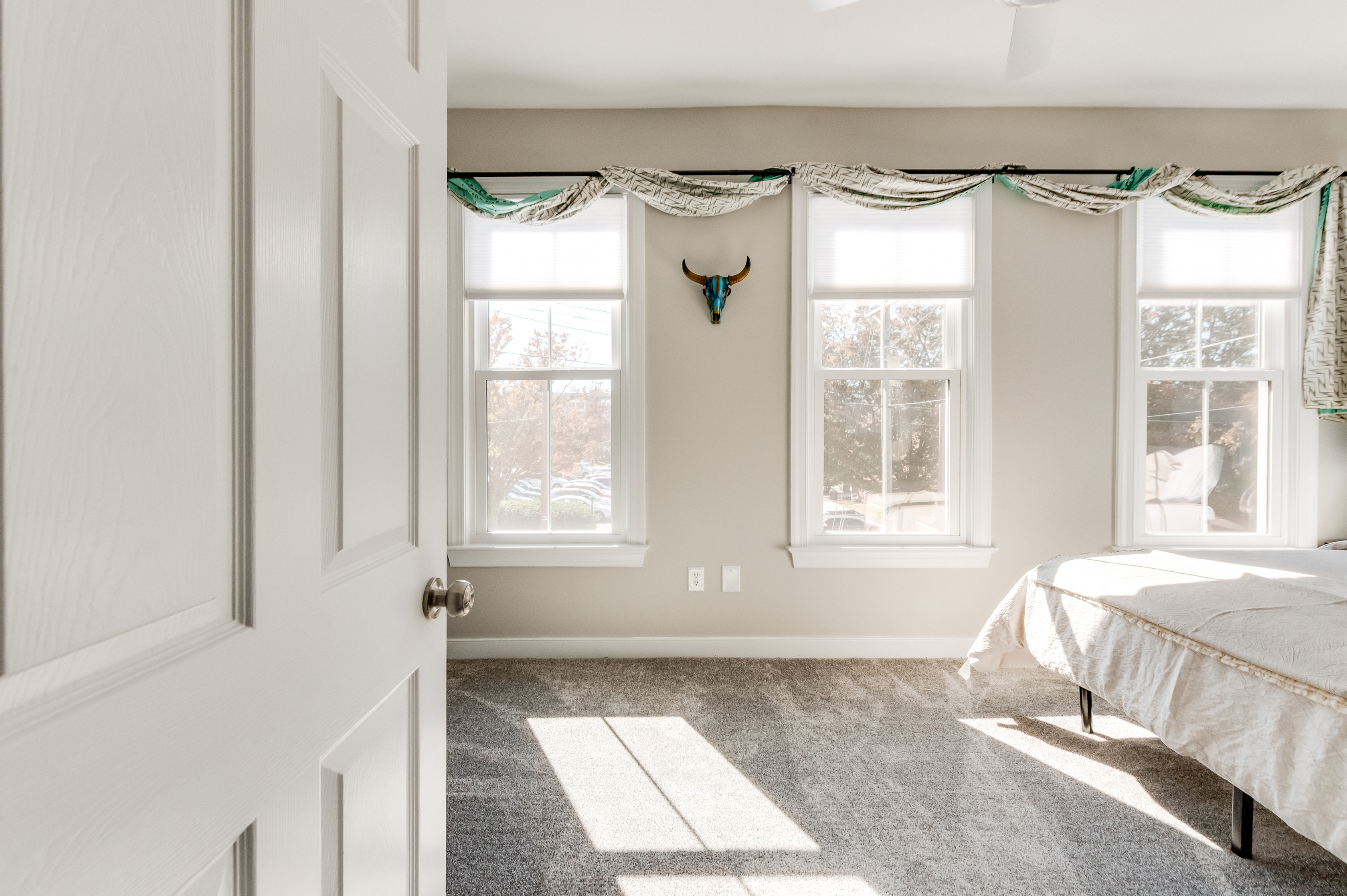 Queen Bedroom 2: Sun-drenched room with chic decor and picturesque views awaits your stay!