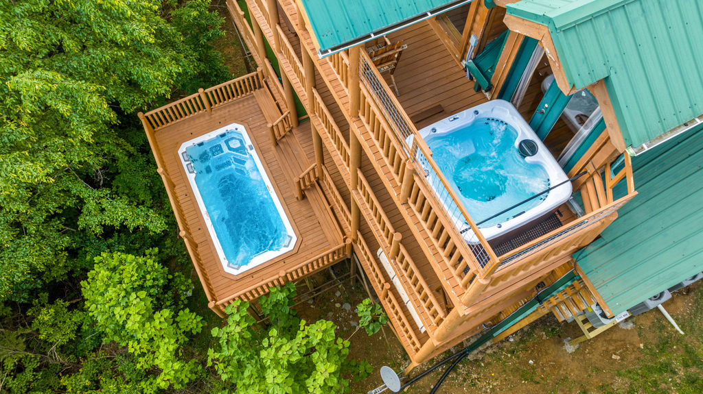 Enjoy the heated 20' SwimSpa on the entertainment deck and a hottub on the 3rd deck while enjoying the view of the Smokies.