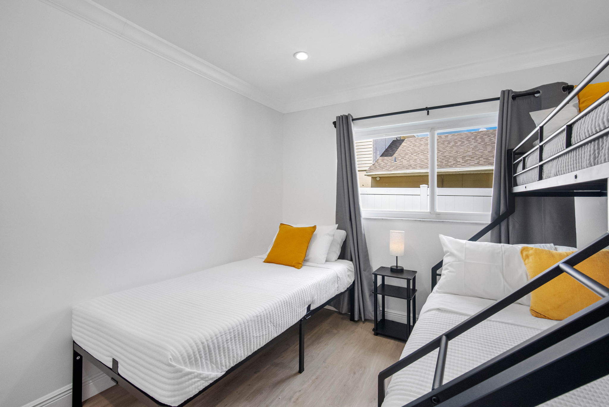 White walls, clean lines, and just the right amount of color make for a calm and modern retreat.