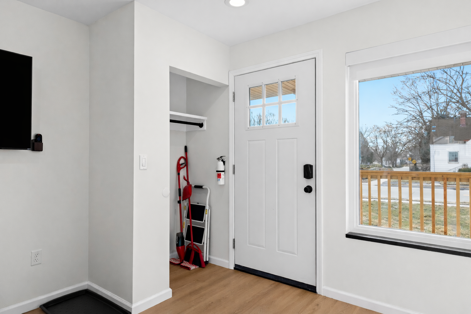 Bright, welcoming entryway with clean lines, warm flooring, and convenient storage—setting the tone for a comfortable, thoughtfully designed stay.