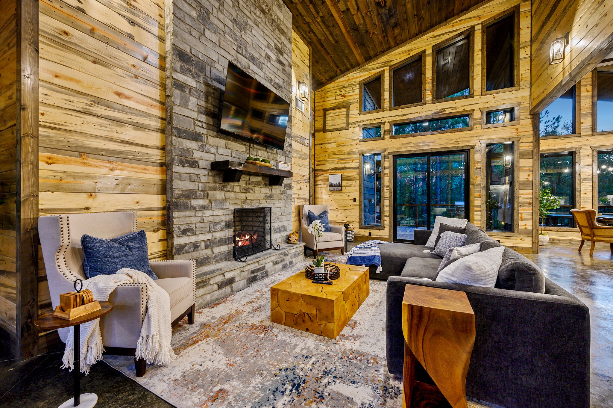 Modern rustic elegance meets floor-to-ceiling forest views.