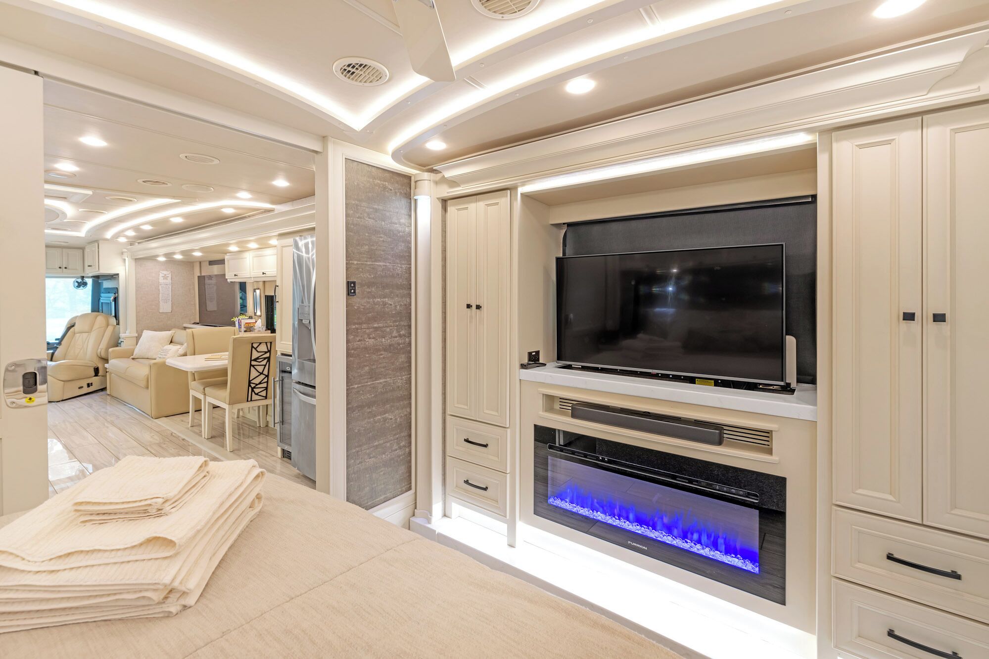 Master bedroom with fireplace and smart TV