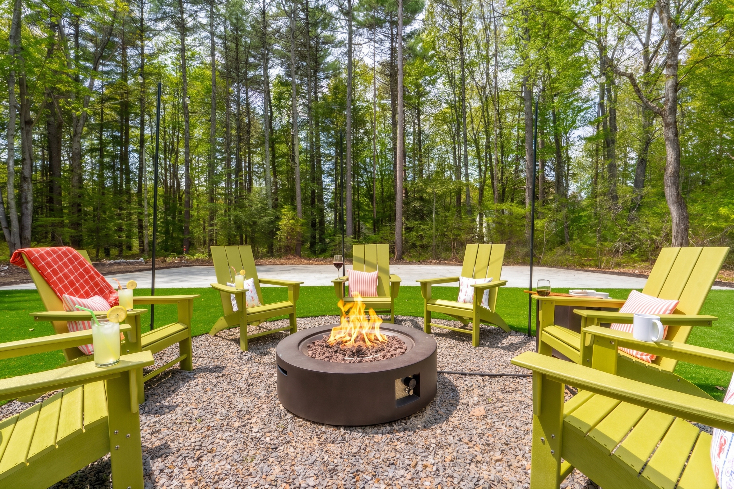 An inviting outdoor firepit surrounded by seating, creating the perfect spot to gather, enjoy drinks, and share stories as the evening winds down.