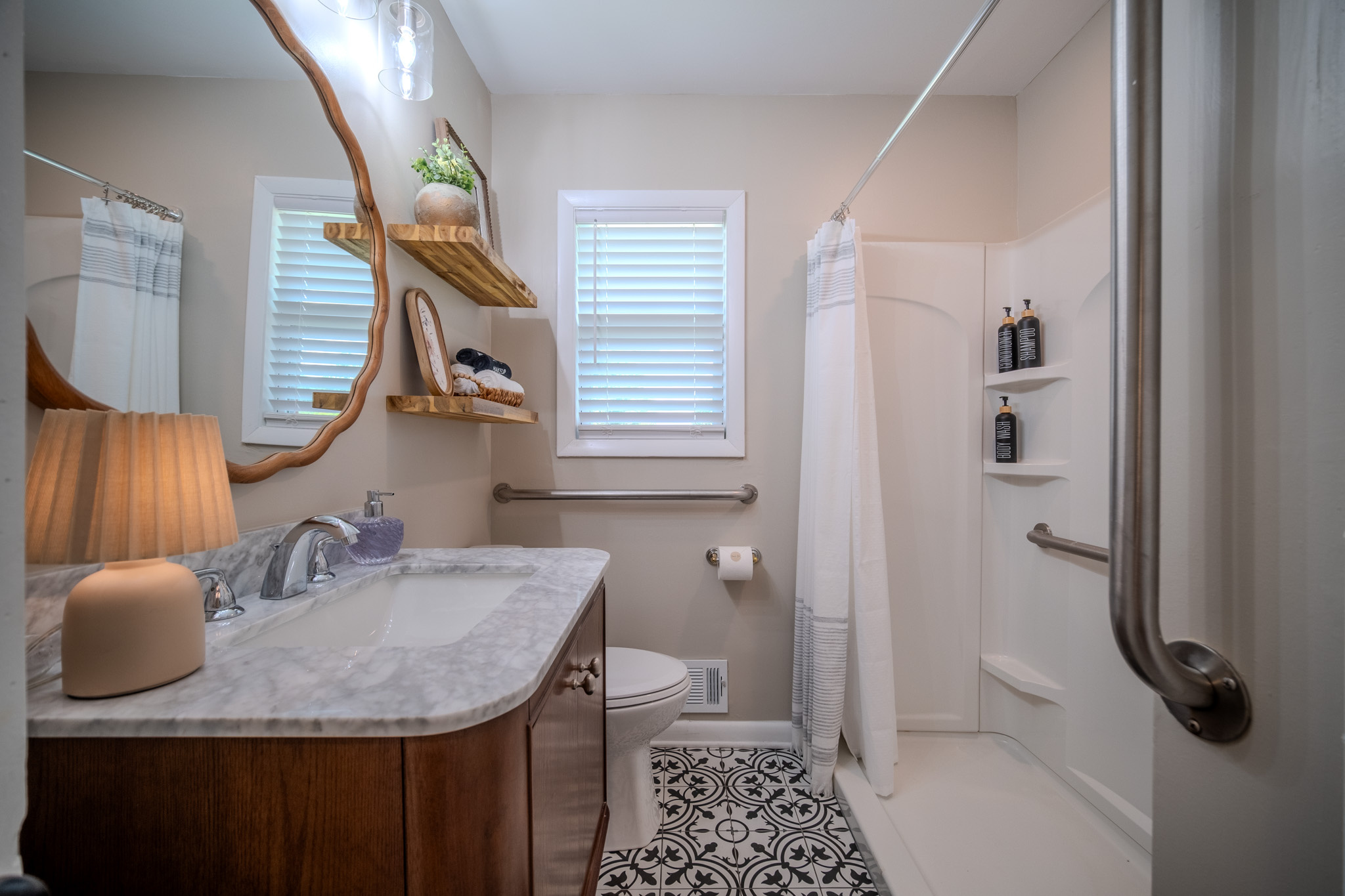 Convenient guest bathroom featuring a walk-in shower, modern finishes, and complimentary toiletries.