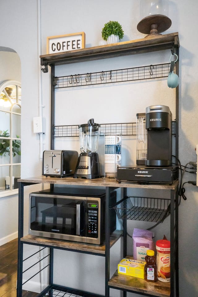 Cozy coffee nook equipped with multiple appliances, perfect for brewing your favorite beverages and starting the day off right.