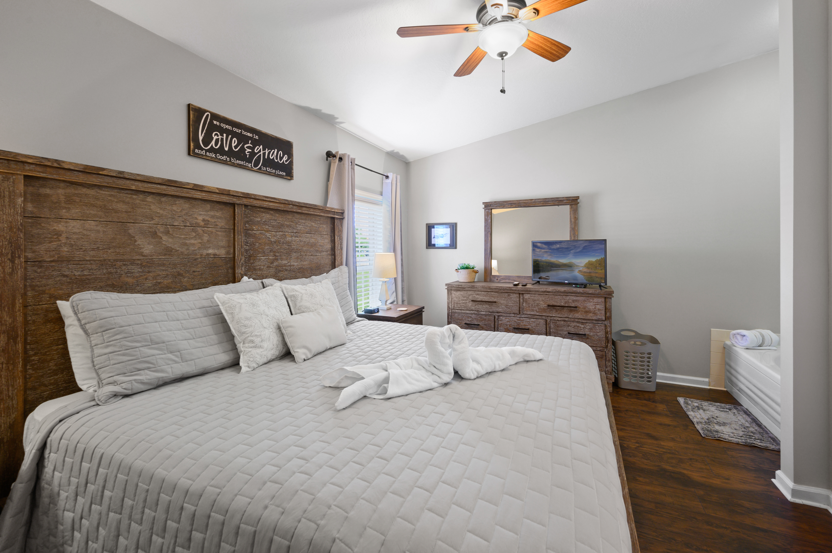 King bed in bedroom and jetted jacuzzi tub