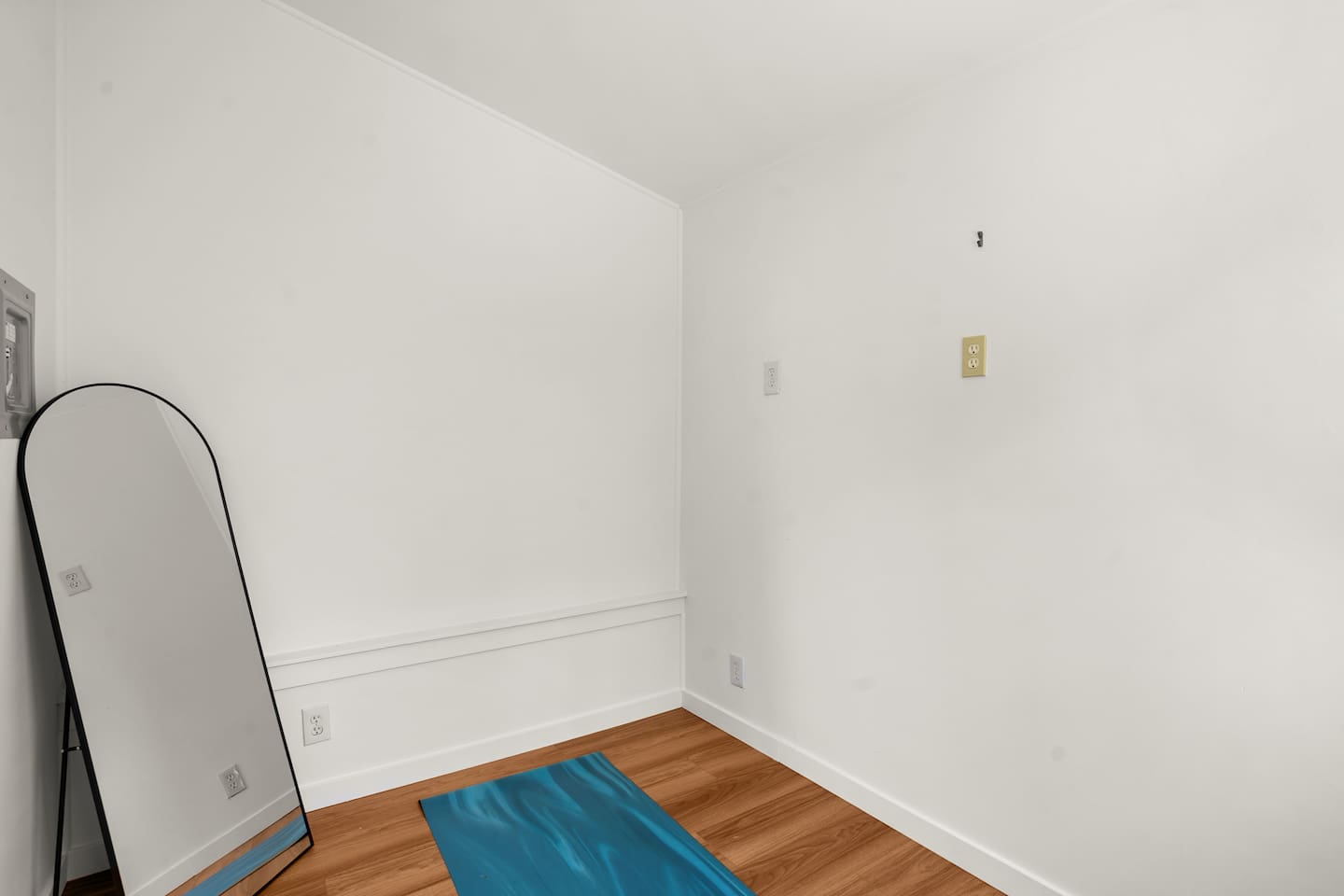 Private gym space equipped with workout essentials, yoga mats, and BootySprout for easy at home workouts and stretching.
