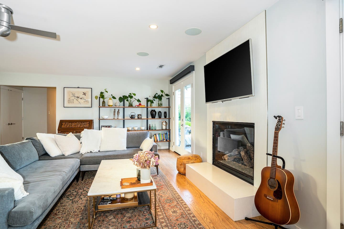 Living area with smart tv and fireplace.