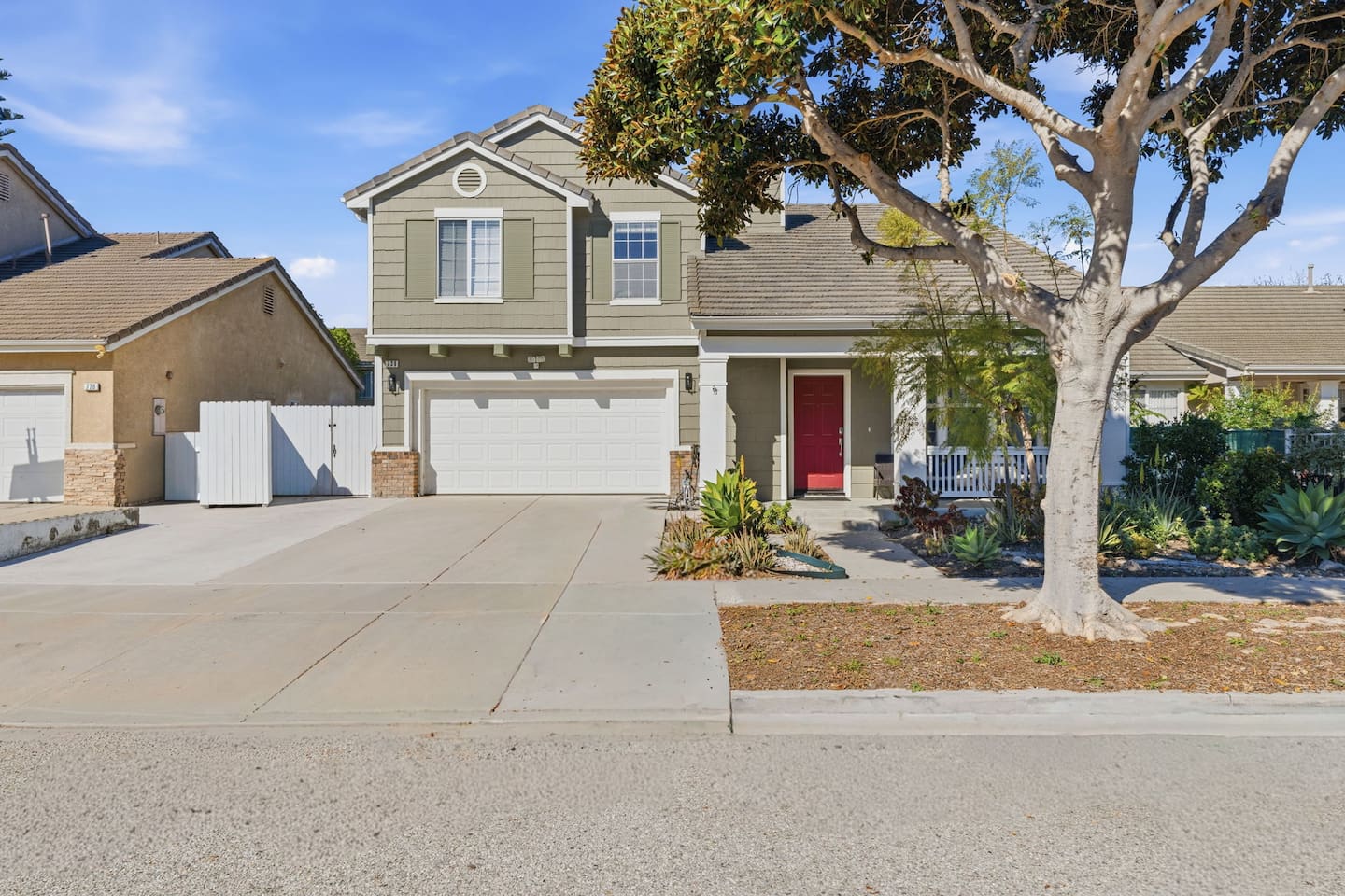 Two-story beach house near Channel Islands Harbor with 3-car driveway parking, mature landscaping, and attached garage. Sleeps 10 guests. Minutes from Oxnard Beach and Hwy 101.
