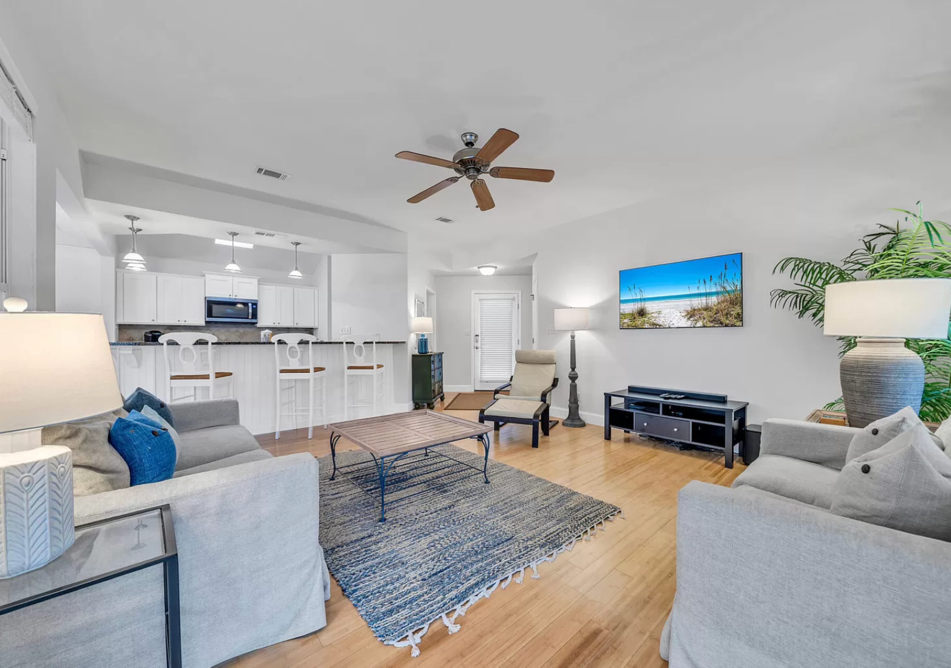 Bright, inviting living room and kitchen—an open-plan hub for relaxation and gathering.