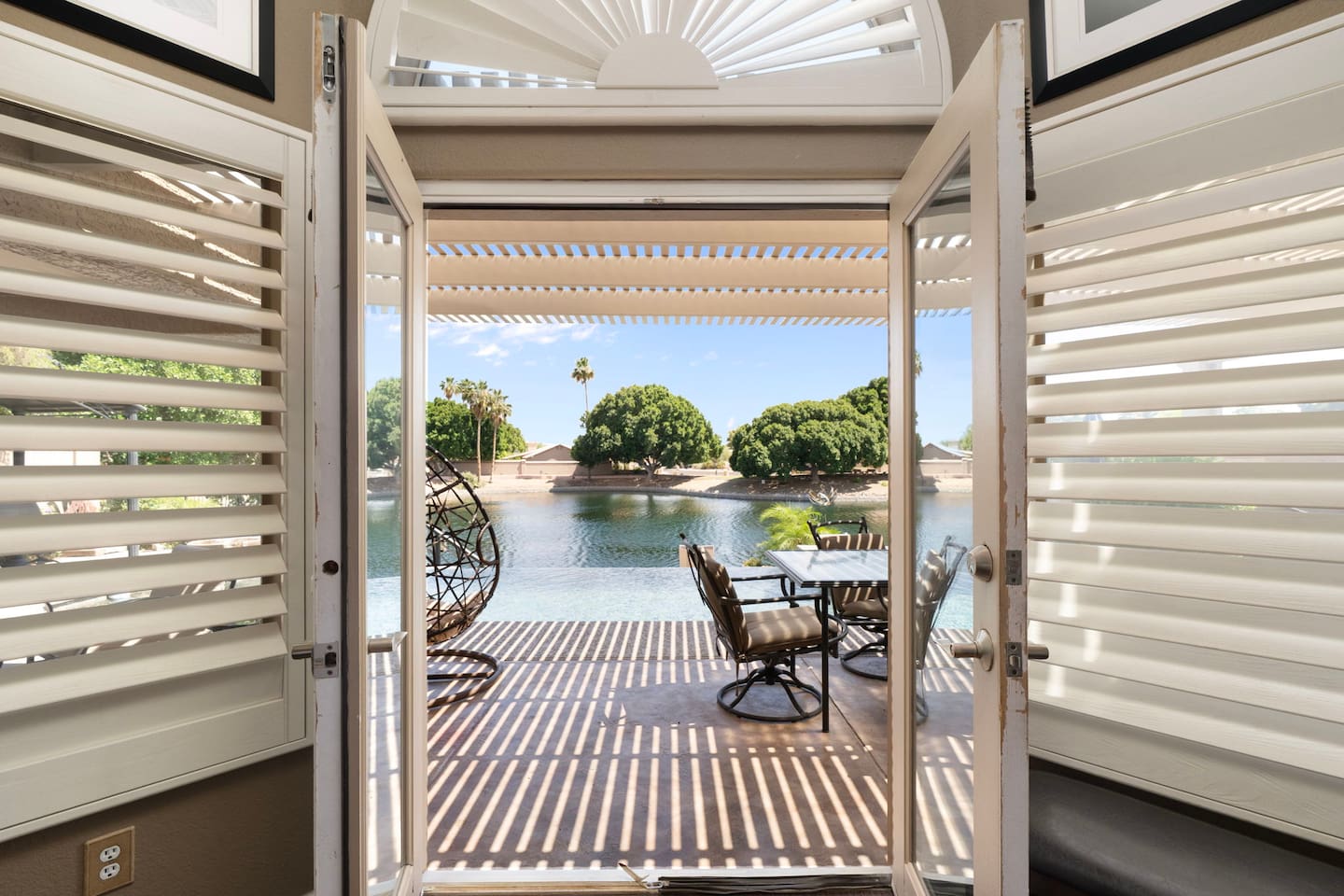 Throw open the French doors from the primary bedroom and let the lake views and morning breeze greet you — a rare and memorable way to start each day of your trip.