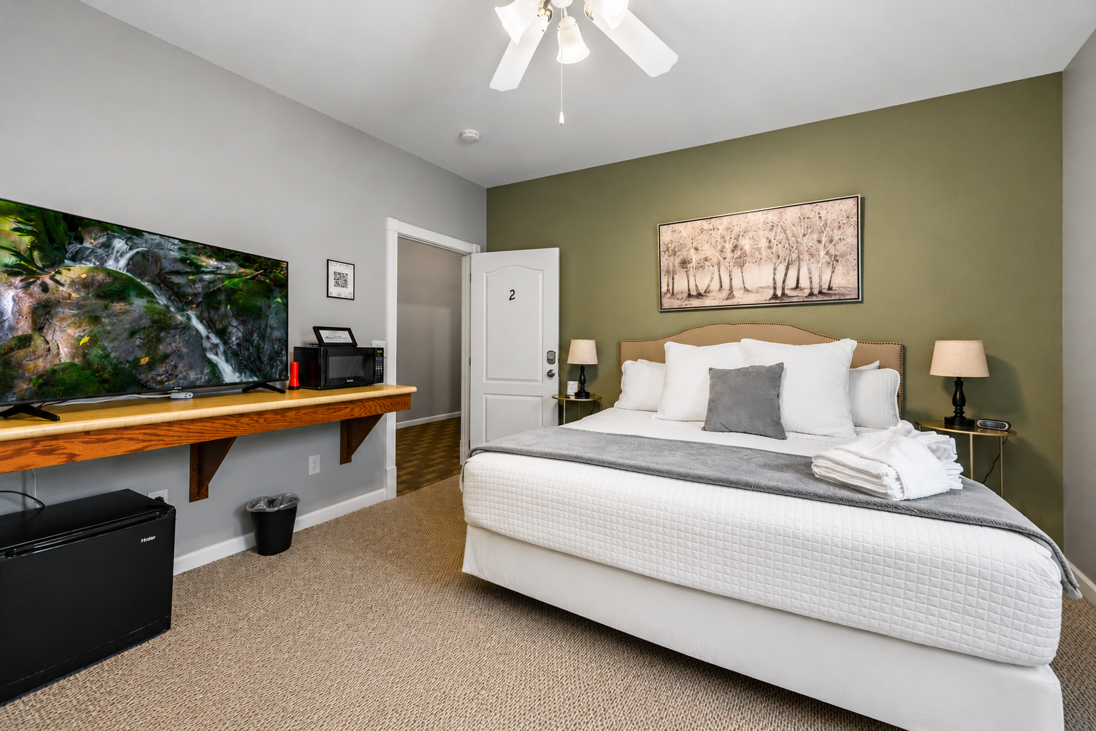 Rest and recharge in the plush king-sized bed, perfect for a peaceful night’s sleep.