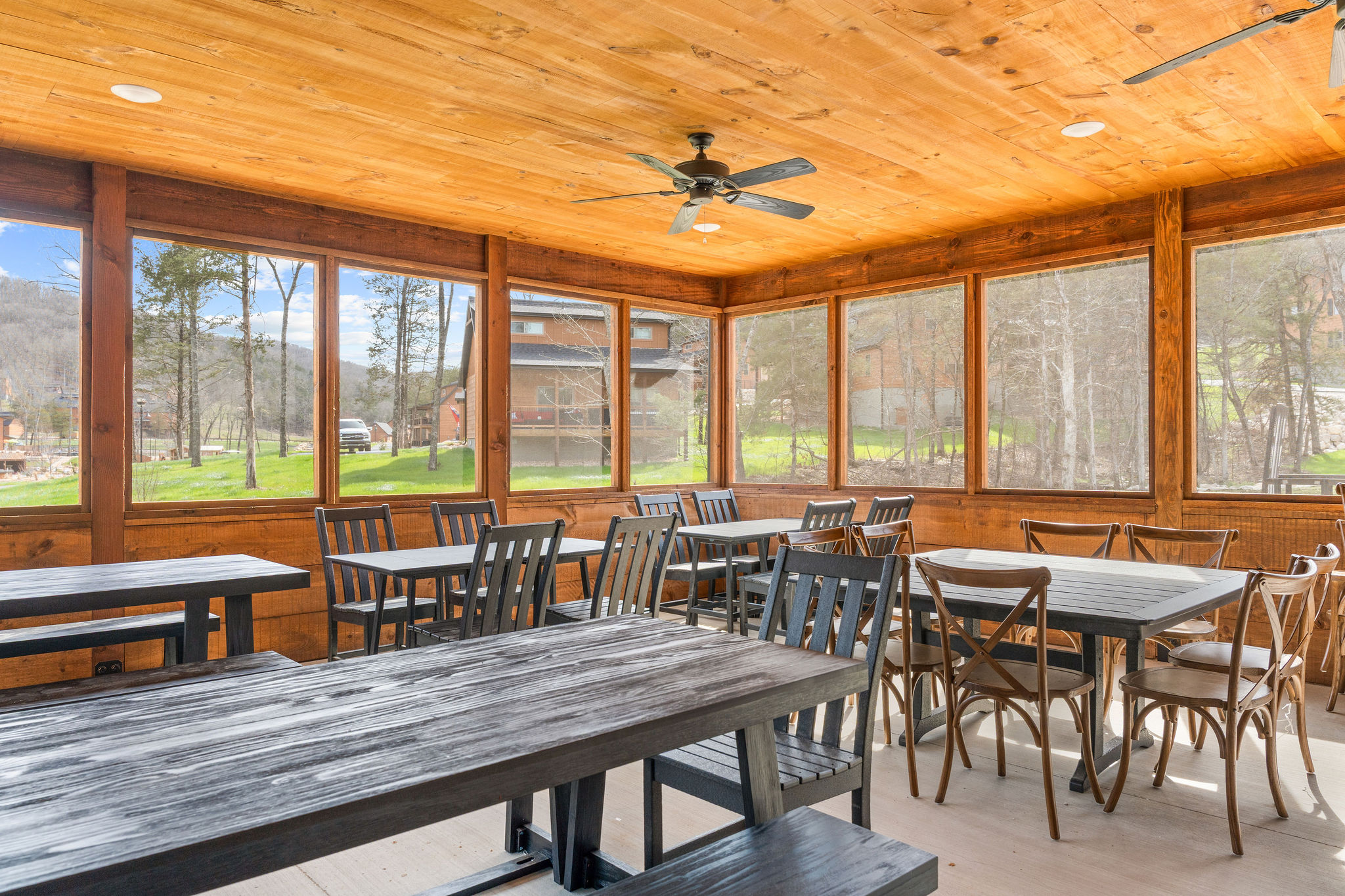 Gather the whole group around the table in the light-filled indoor commons.