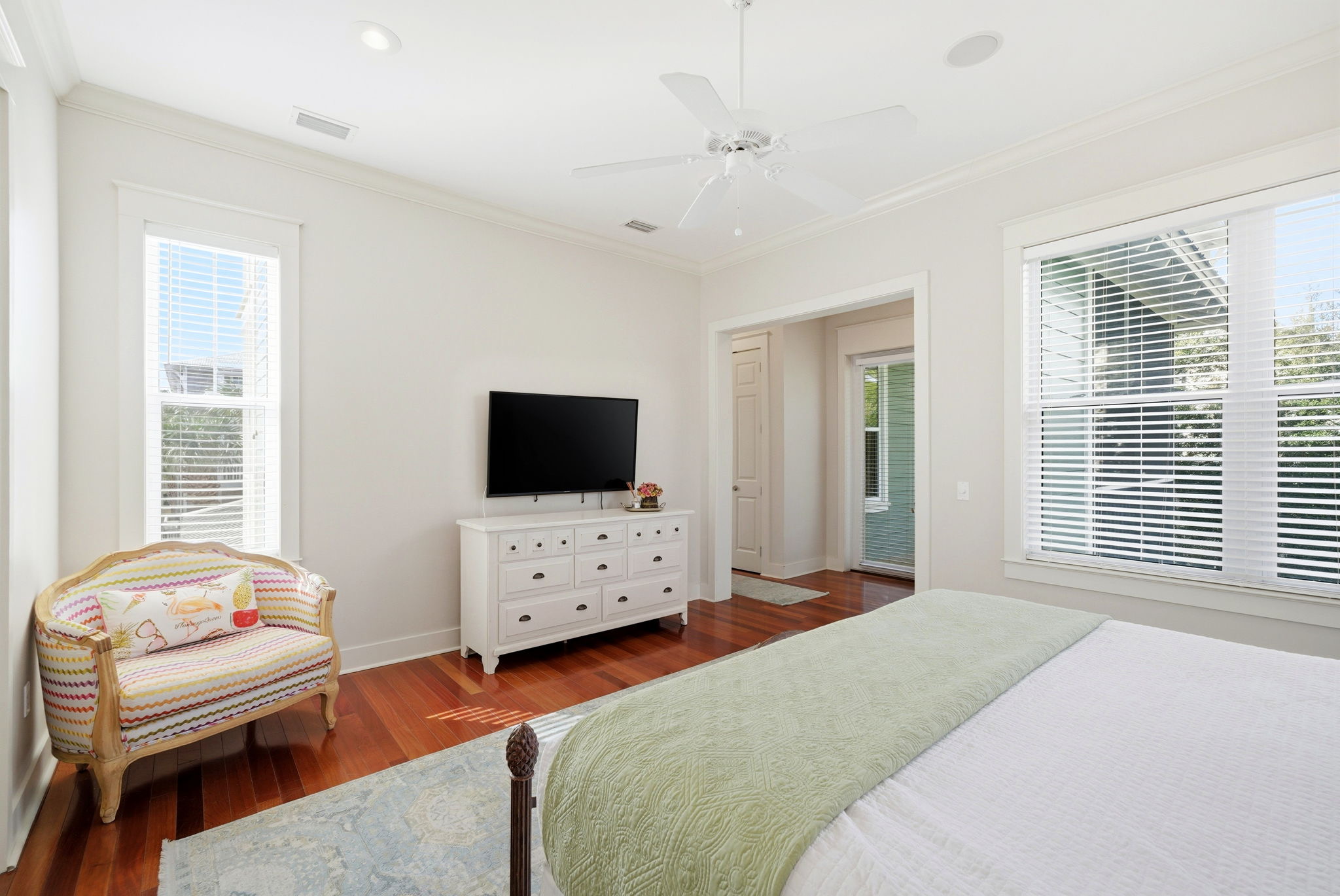Wake up to natural light in this spacious bedroom, offering plenty of room to stretch out and relax.