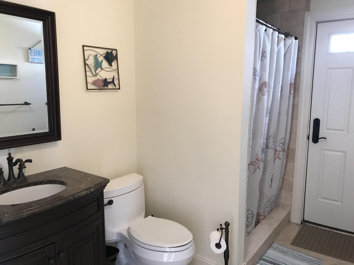 Full bath on ground level.  Can be accessed from exterior of property or garage