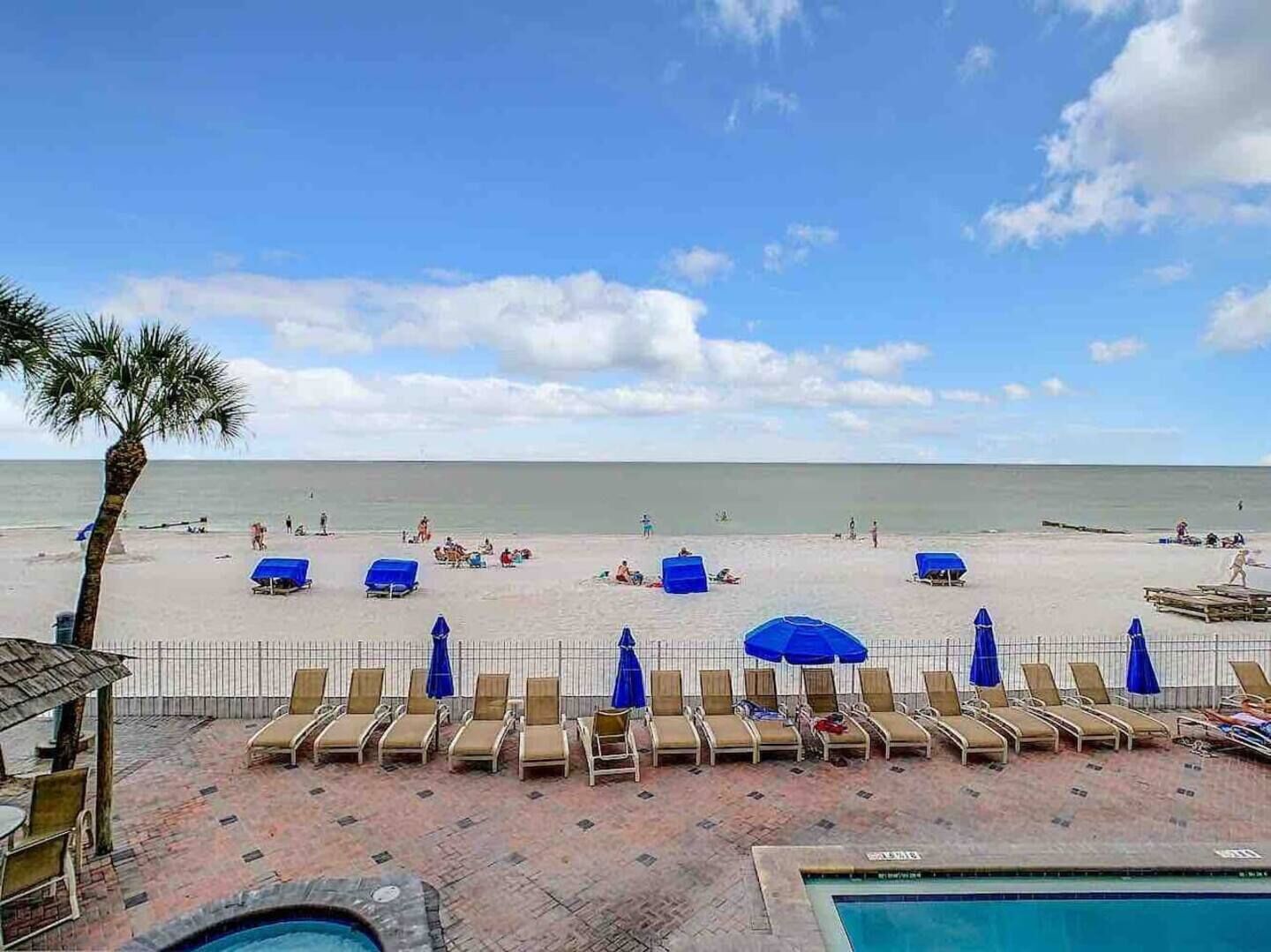 View of the beach and pool loungers