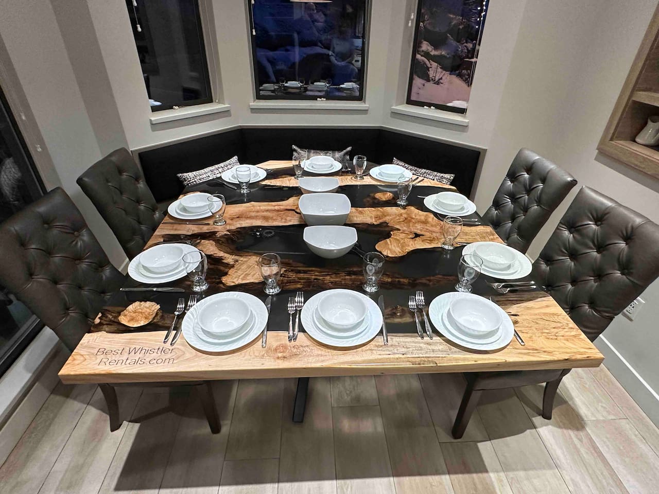 Extra large maple wood table was custom built in 2024. This unique live edge table offers more than enough room to comfortably seat 10 people. Dinnerware for 10ppl. Windows on 2 sides brings Whistler Blackcomb nature views  right into your kitchen 
