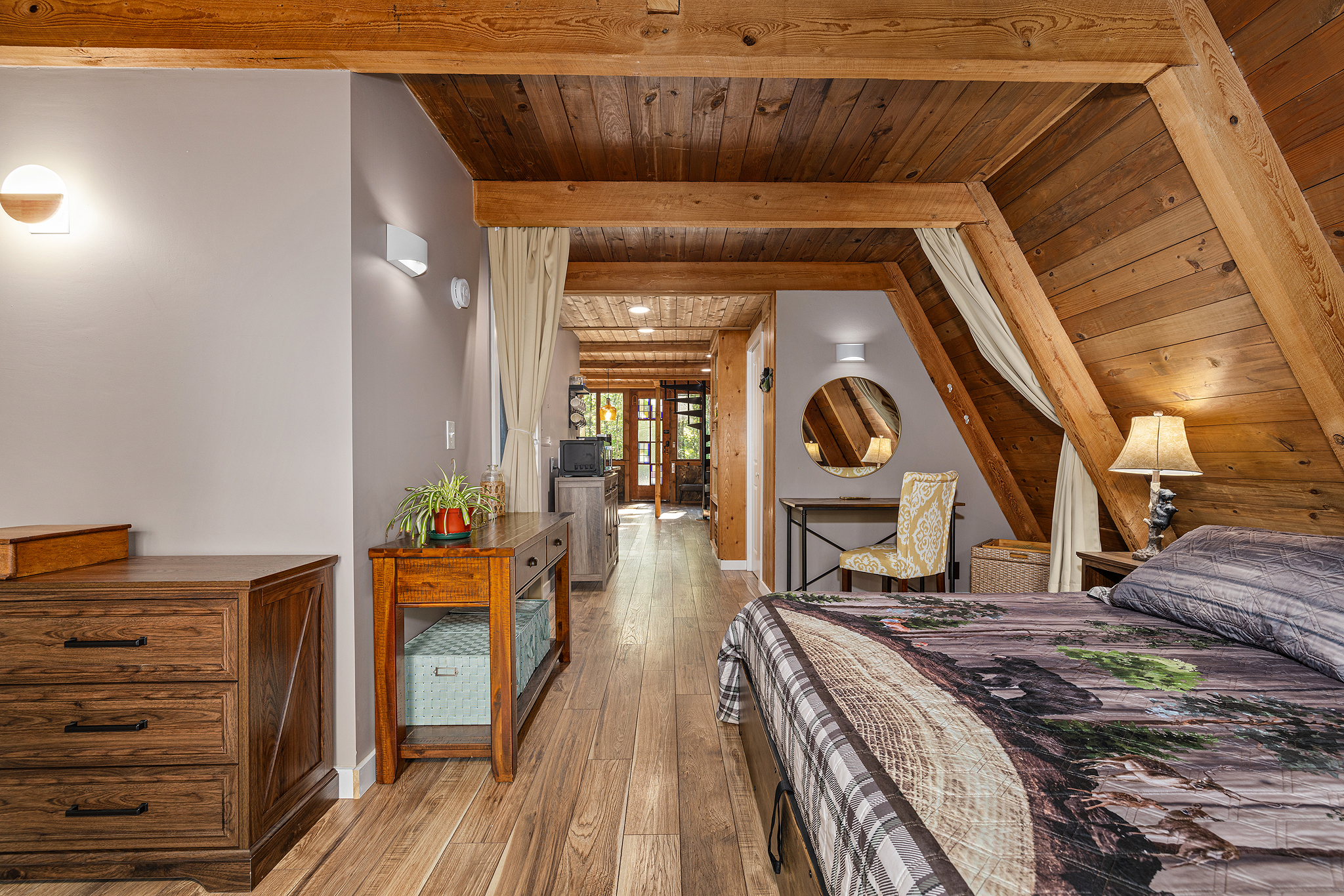 Spacious master with warm wood tones.