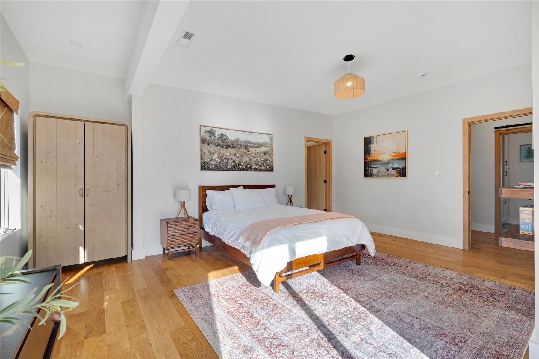 Spacious Bedroom with a Queen bed and access to the balcony along with it's own Bathroom and TV. 