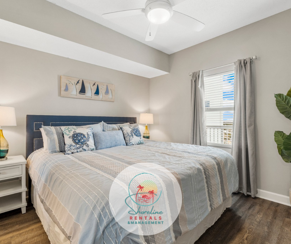 Master bedroom with a king-sized bed, flat-screen smart TV, and a private full bathroom.