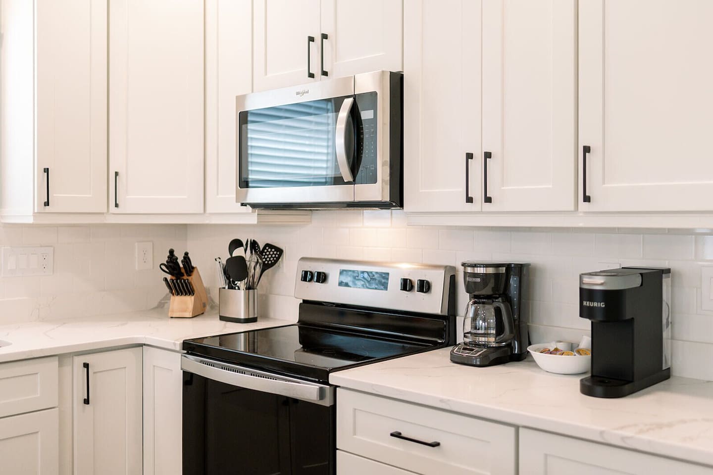 Enjoy both Keurig and drip coffee makers plus a fully stocked setup for home cooking.