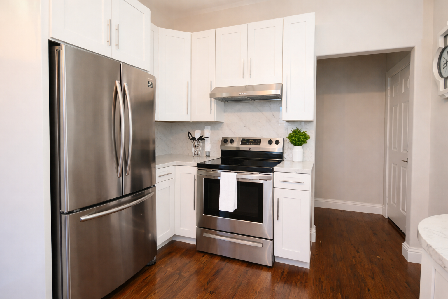 Modern convenience at your fingertips. Features include a deep stainless steel sink, a professional-grade range, and a spacious French-door refrigerator.